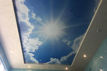 Натяжные потолки в виде неба с облаками